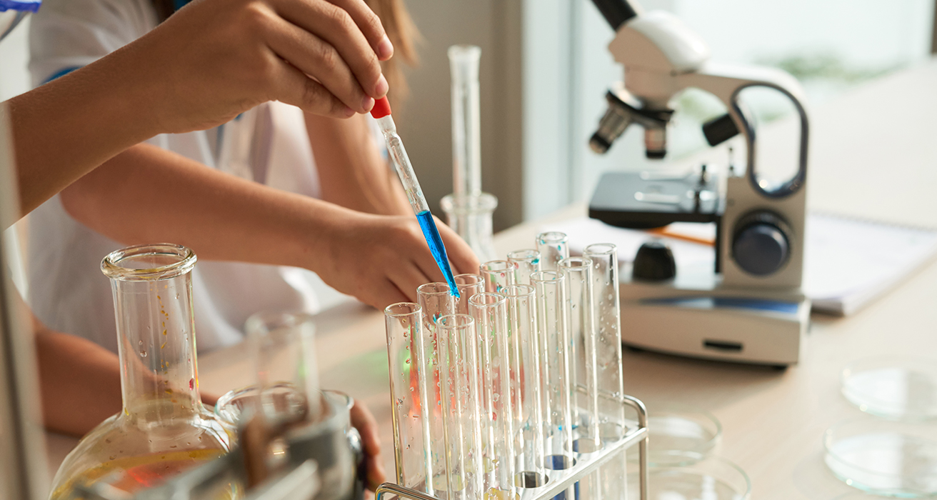 Students working with science lab equipment